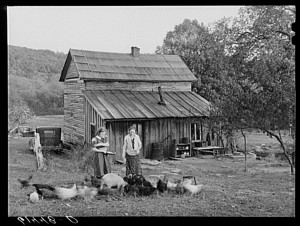 Lansing and daughter feeding chickens. They are FSA (Farm Security Administration) borrowers. Ross County, Ohio.2