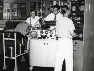 Disk Oxygenator being used by Dr. Earle B. Kaye