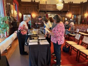 women looking at archival materials